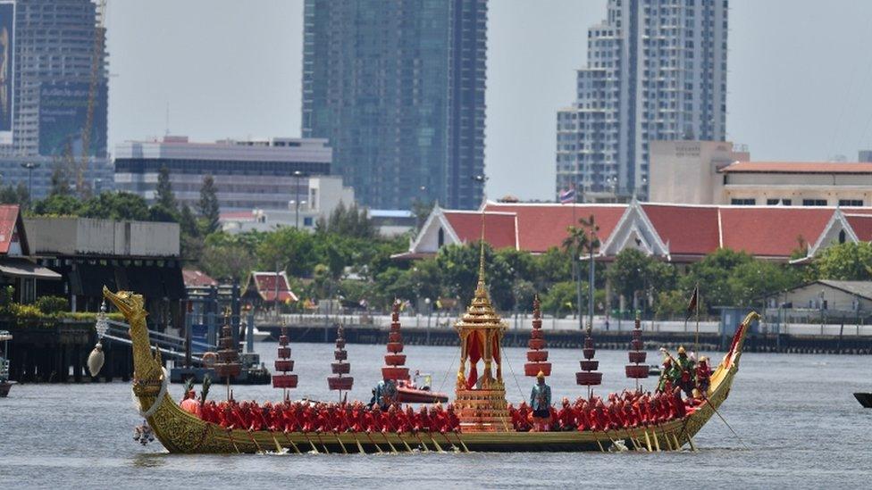 Thai navy members take part in a water procession for the coronation of King Maha Vajiralongkorn as they sail down the Chao Phraya River in Bangkok, 4 May 2019