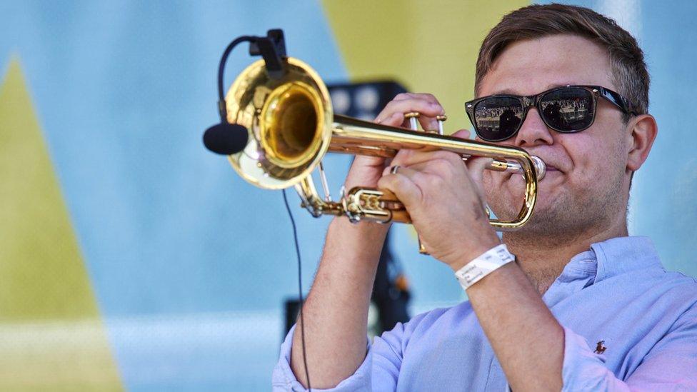 Man playing trumpet at We Invented The Weekend on Saturday