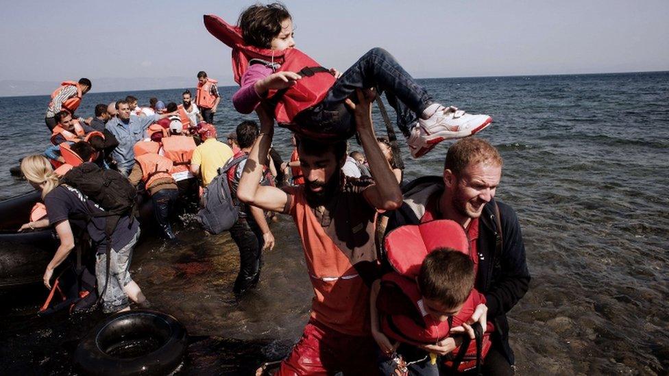 Refugees and migrants arrive on the Greek island of Lesbos