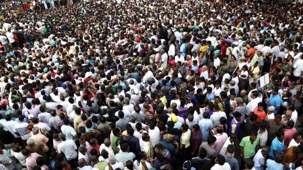 Supporters of United National Party (UNP) leader Ranil Wickremesinghe taking part in a rally near the Prime Ministerial residence of the "Temple Trees" in Colombo, Sri Lanka