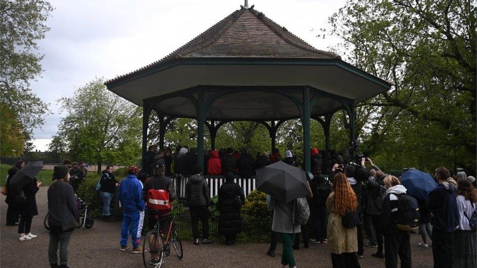 People attend a vigil in Ruskin Park for Sasha Johnson