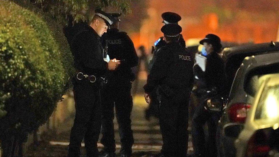 Police officers at an address in Rutland Avenue