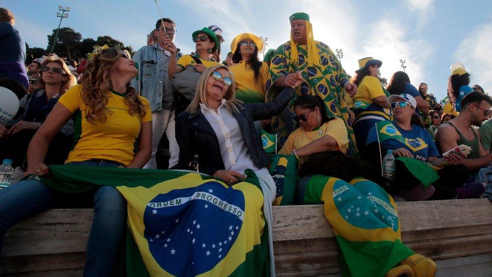 Brazilians are seen at the handover ceremony for the Olympic Torch