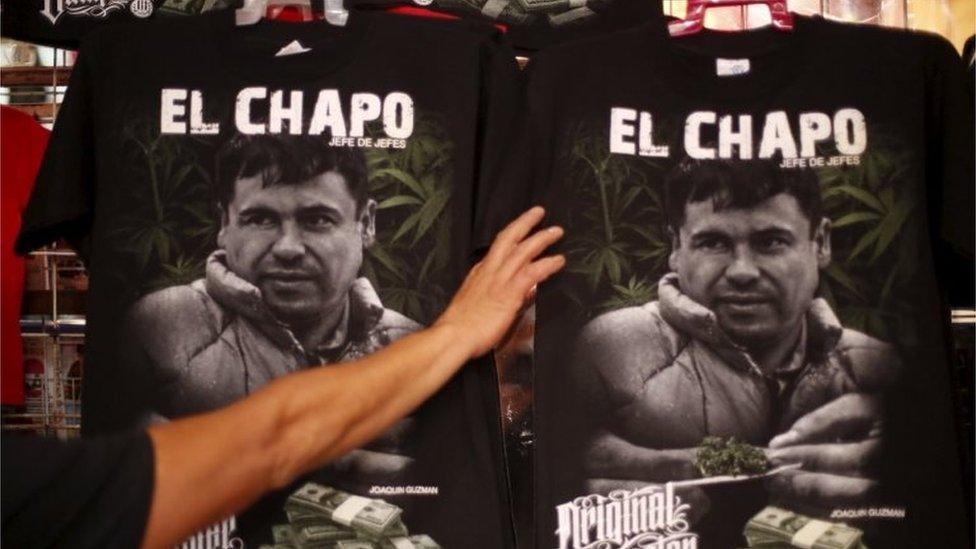 T-shirts with an image of Joaquin "El Chapo" Guzman for sale in a market