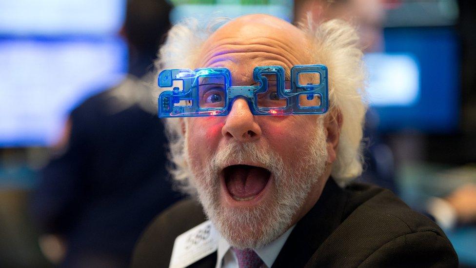 A trader works on the floor at the closing bell of the Dow Industrial Average at the New York Stock Exchange on December 29, 2017 in New York.