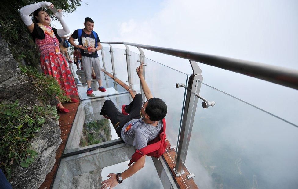 People take photos on the glass walkway (1 Aug 2016)