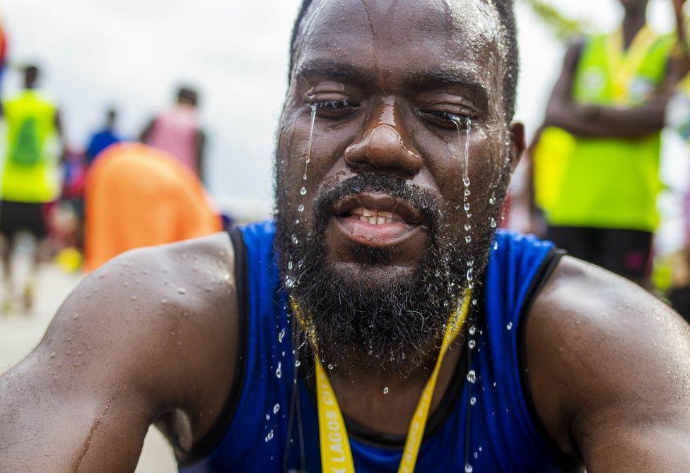 Man with water pouring down his face