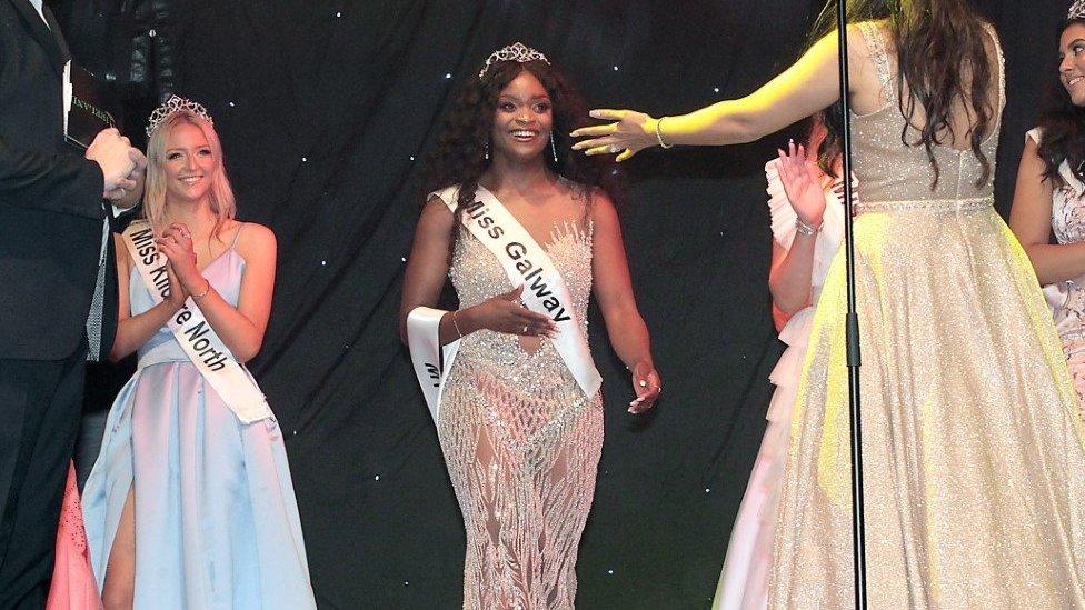 Pamela standing next to two other contestants in the Miss Ireland competition