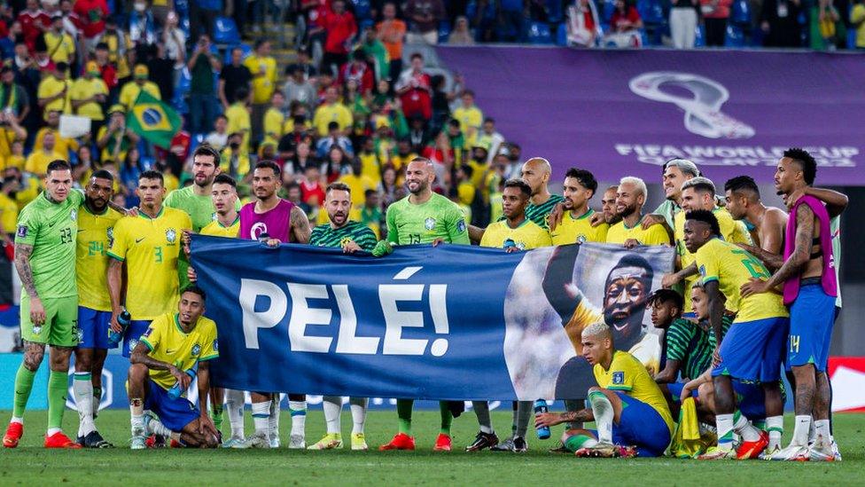 Brazil players holding banner in support of Pele at 2022 Qatar World Cup