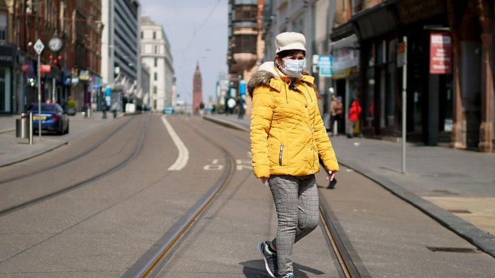 A pedestrian wearing a face mask in Birmingham city centre