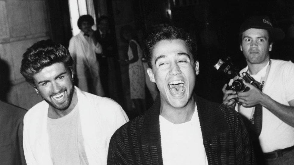 Wham! followed by paparazzi in the 1980s