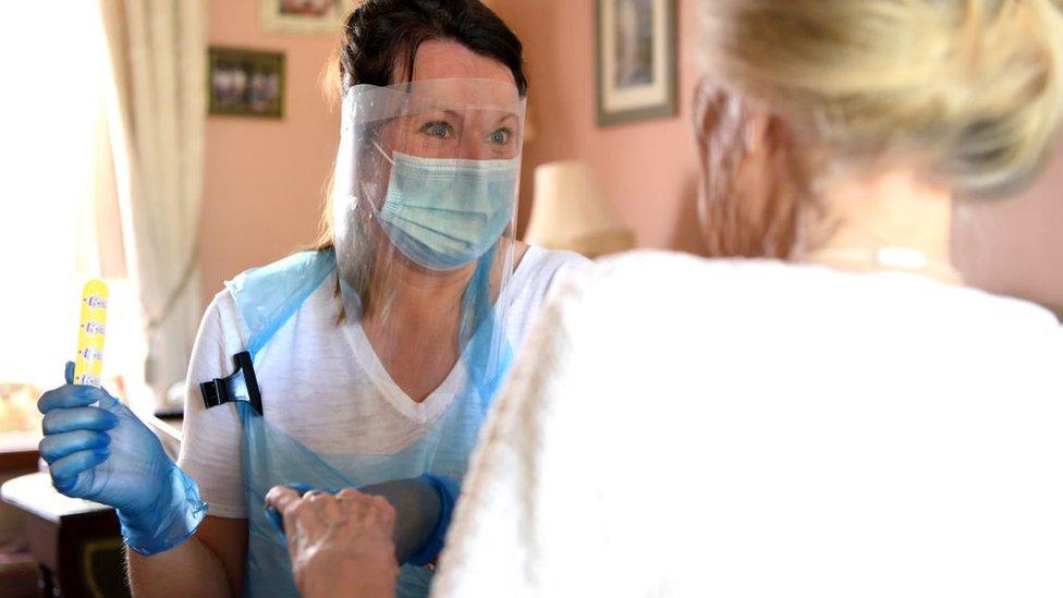 Woman care worker with a patient