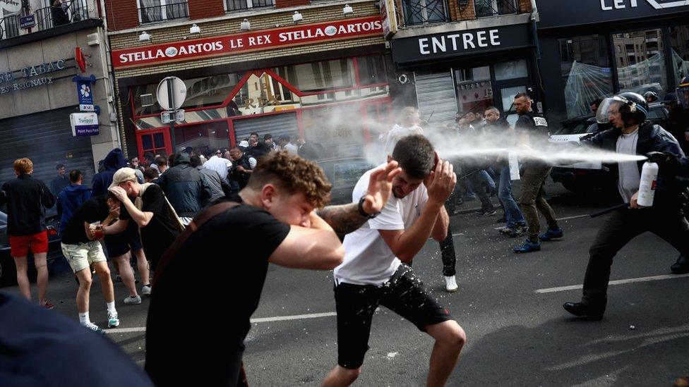 Fans being sprayed with pepper spray