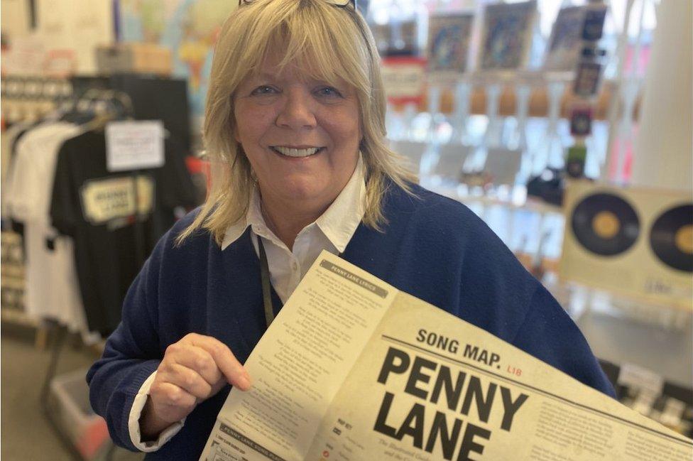 Julia Gornell holding a music map of penny lane