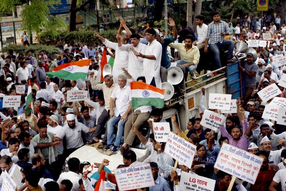 AAP volunteers march in support of Delhi chief minister Arvind Kejriwal at LG's office in Delhi.