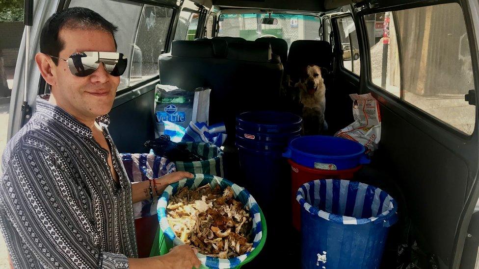 Fernando Kushner collects food from fast food restaurants