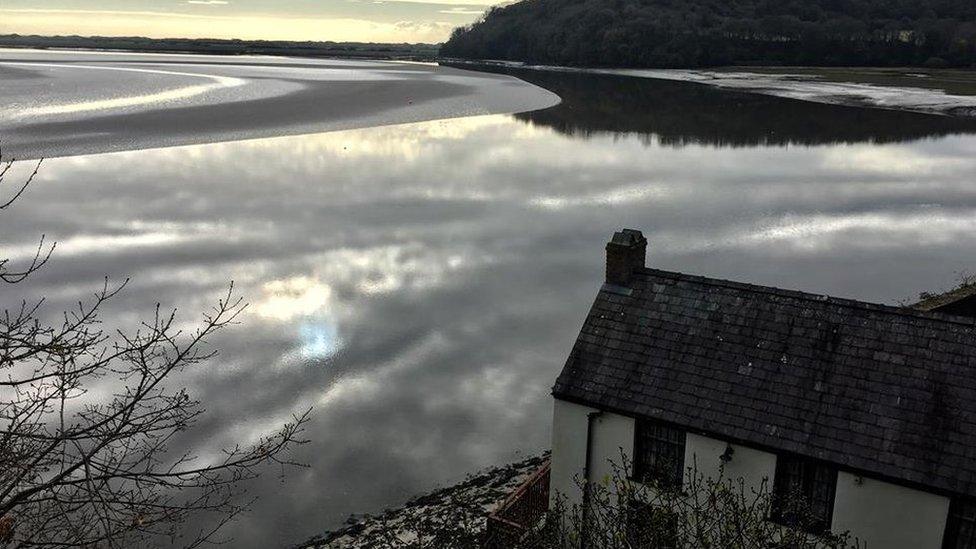 The boathouse of Dylan Thomas on the banks of Laugharne Estuary