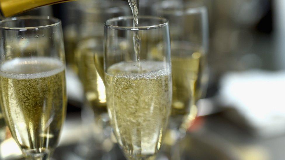 Champagne being poured into Champagne Flutes