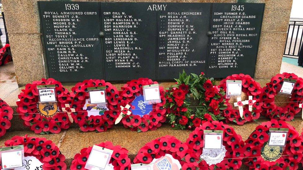 Wreaths at the foot of Douglas war memorial