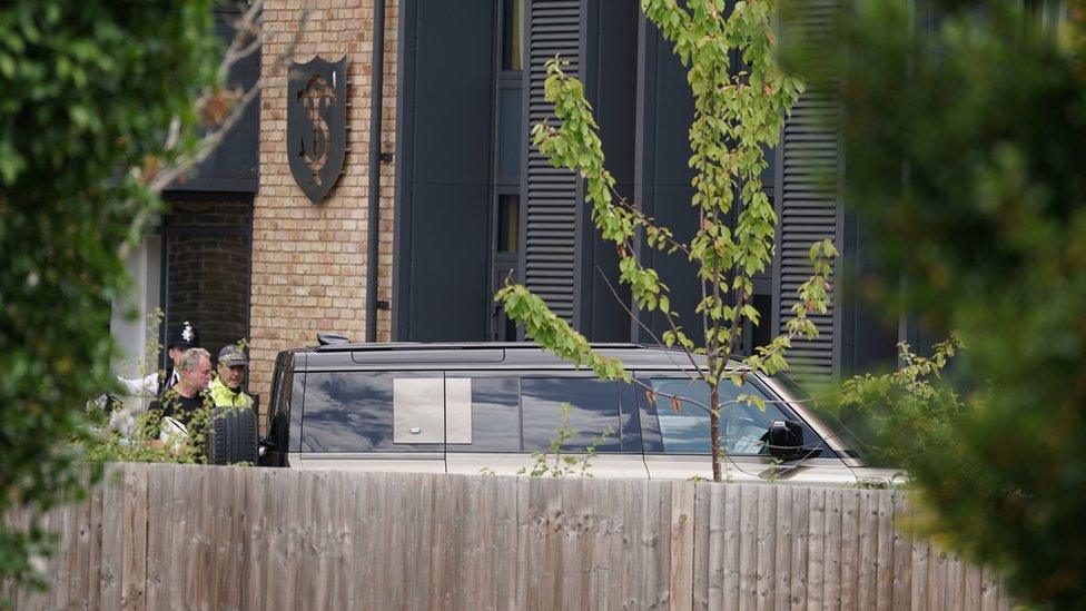 A Land Rover Defender is seen inside the grounds of The Study Preparatory School