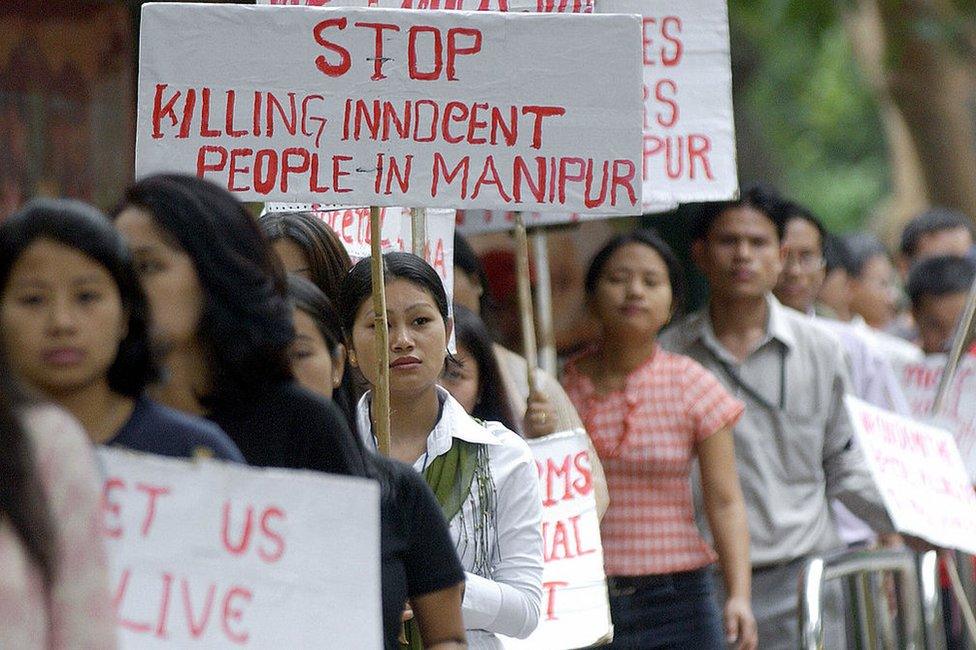 Indian students from the country's northeastern state of Manipur take part in a rally in Bangalore, 13 August 2004, to protest against the alleged killing in military custody of a 30-year-old woman