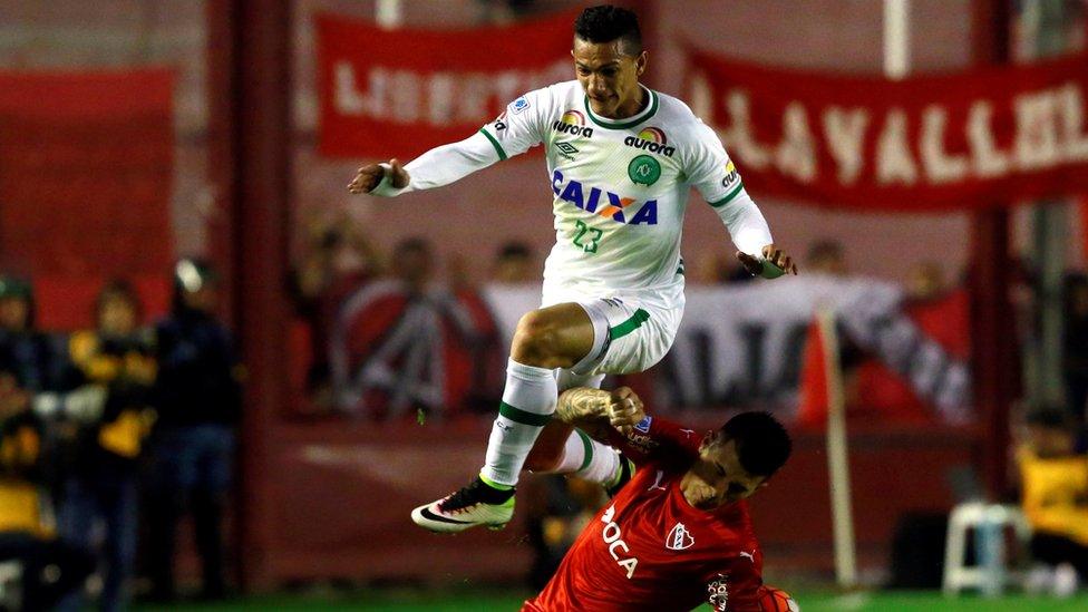 Chapecoense's Lucas Gomes jumps over Independiente's Victor Cuesta, in Buenos Aires, Argentina, on 21 September