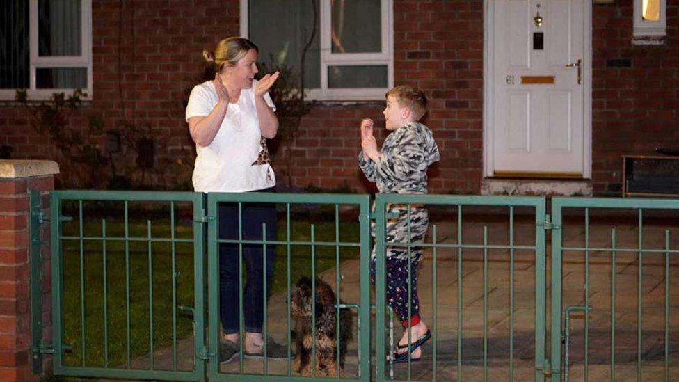 Residents in Manchester cheer for the NHS