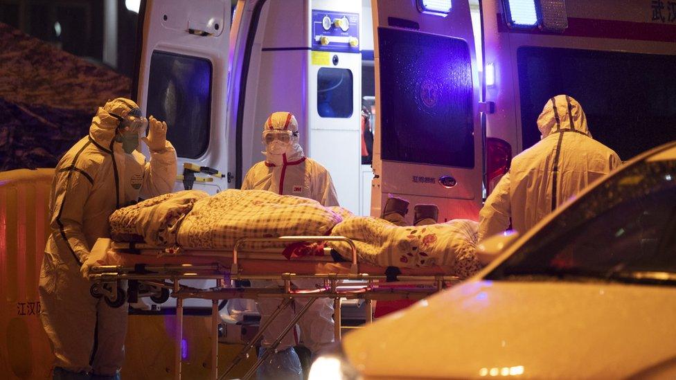 Medical staff transfers a patient at Hospital of Wuhan Red Cross Society in Wuhan City, Hubei Province, China