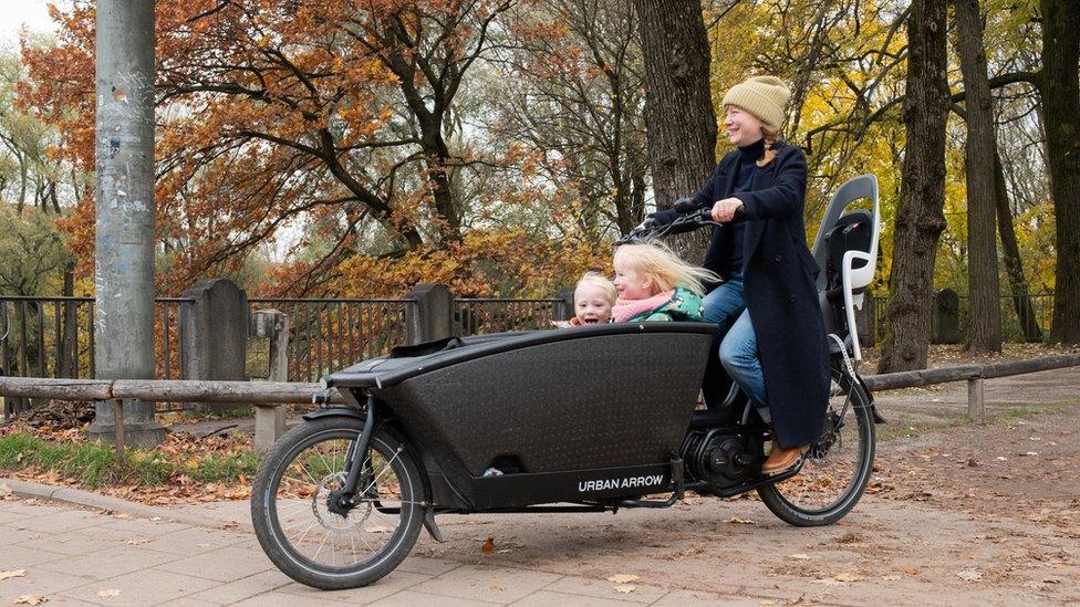 Grit Paulussen and her children with their cargo bike