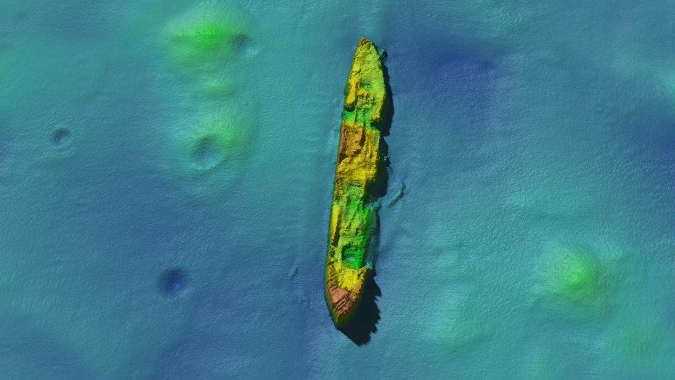 SS Damao lying bow in a north-south position with four craters on the seabed to its left