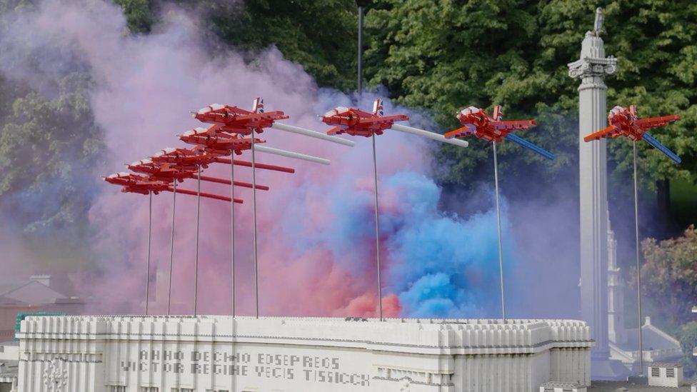 Lego models of the Red Arrows flying of a replica of London