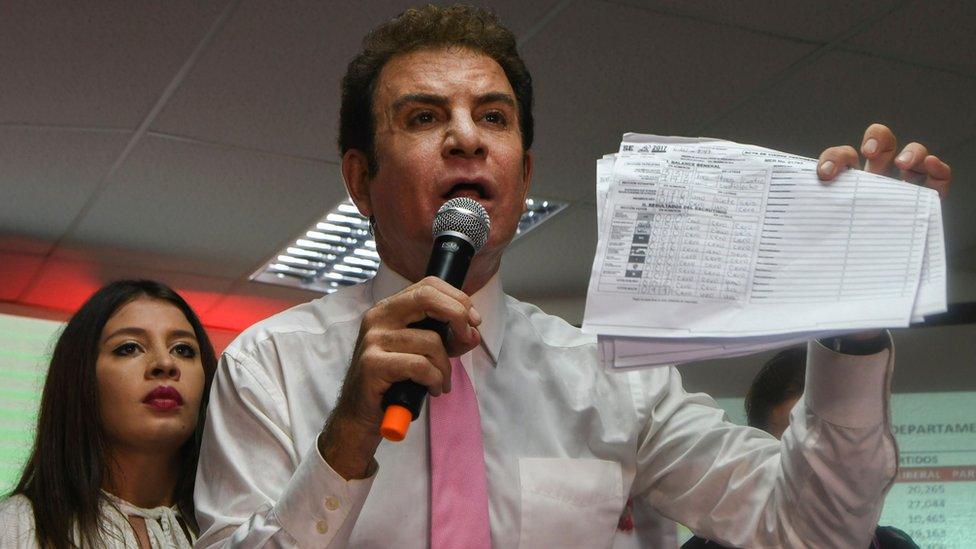 Salvador Nasralla waves to supporters as he prepares to display vote tallies, which he claims show that he won the 26 November general election, in Tegucigalpa, Honduras, 29 November 2017