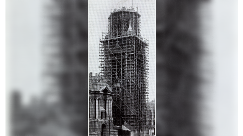 A black and white newspaper clipping of the Wills Memorial Building under constructions showing it wrapped in wooden scaffolding