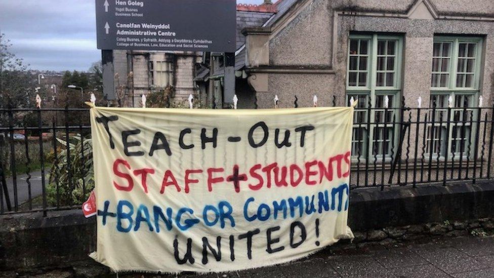 A banner for the strike at Bangor university