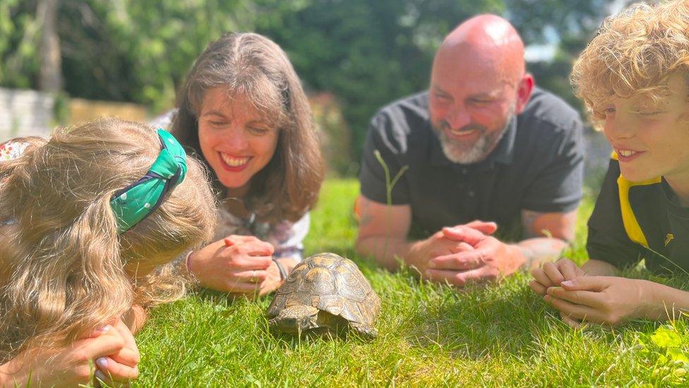 A family with Twin the tortoise