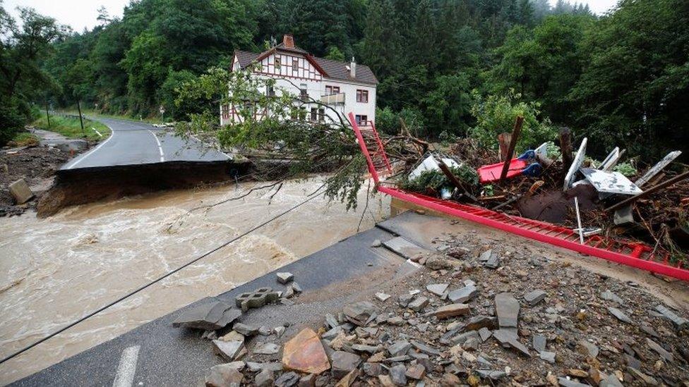 A destroyed road next to the Ahr river is seen on a flood-affected area following heavy rainfalls in Schuld