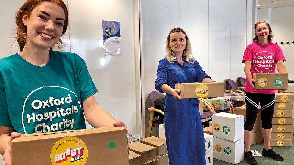 Natasha Weibel, Change and Effectiveness Lead in the NOTSSCaN Division, flanked by Charity volunteers Tamara Moon and Amy O'Hanlon, in the Charity Support Hub in the West Wing at the John Radcliffe Hospital