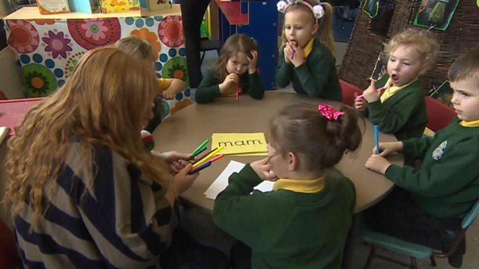 Teaching assistant and pupils