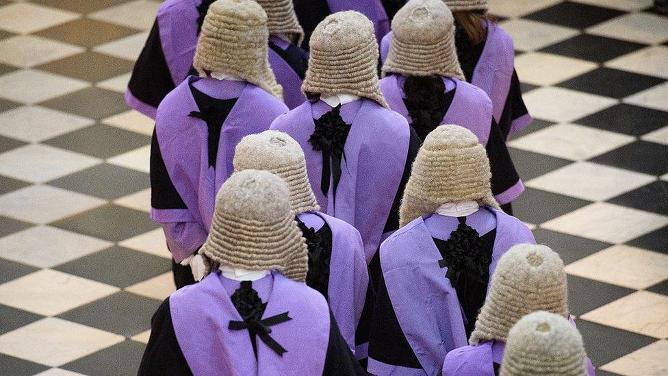 Judges and members of the legal profession take part in a procession inside Westminster