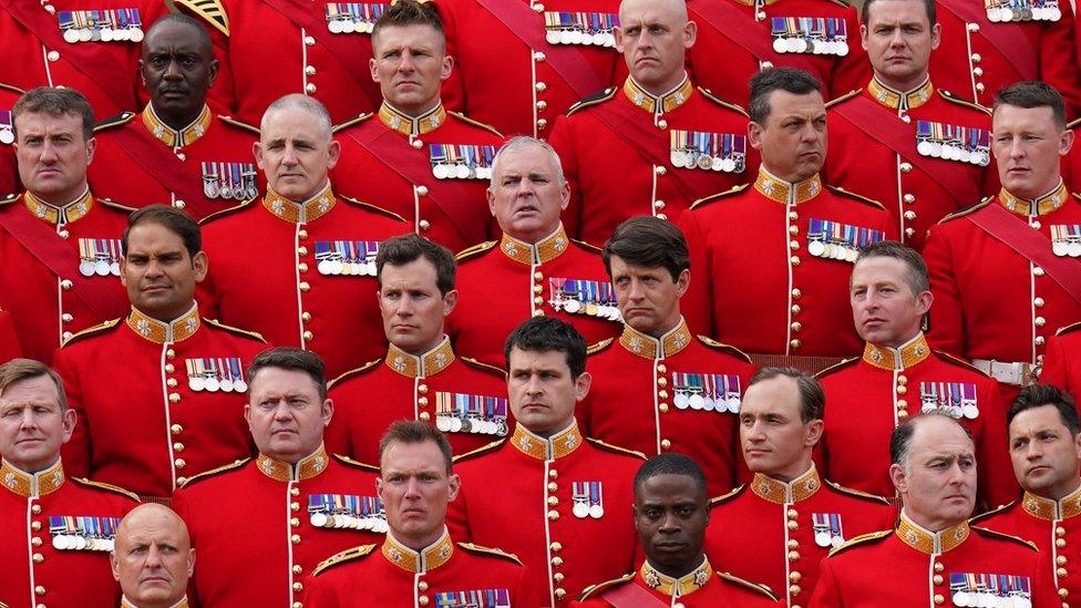 Household Division Officers and Senior Non-Commissioned Officers, who will be taking part in the Coronation, gather at Wellington Barracks for a formal photograph with Britain's Anne, Princess Royal