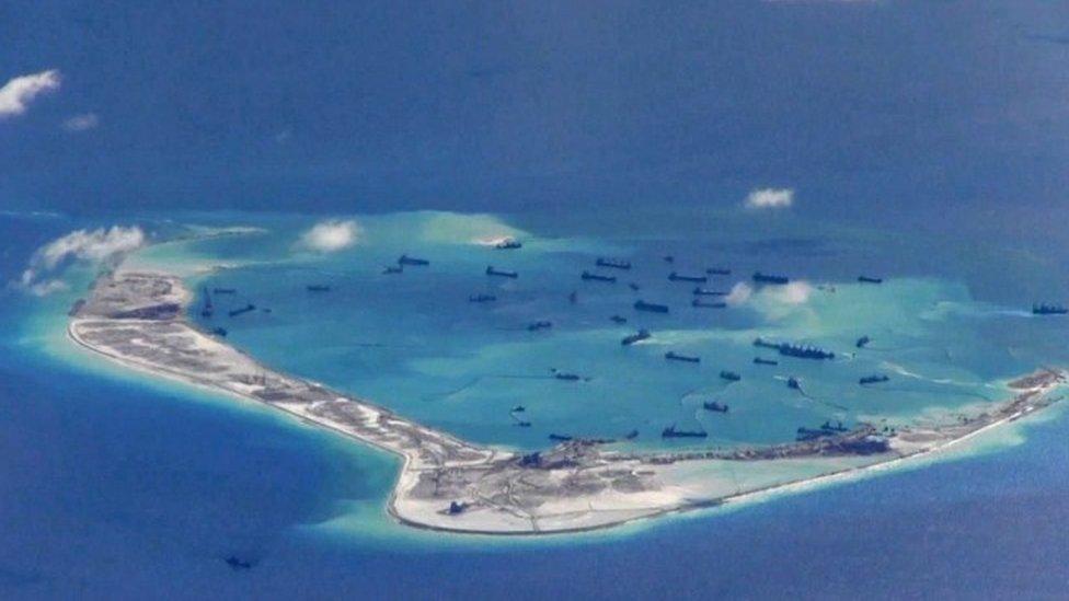 Chinese dredging vessels around Mischief Reef in the disputed Spratly Islands in the South China Sea