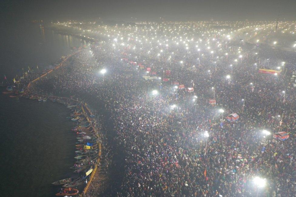 An aerial shot of pilgrims at Kumbh waiting to take a dip