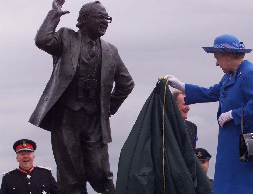 Lord-Lieutenant of Lancashire (left) with the Queen as she unveils the Eric Morecambe statue