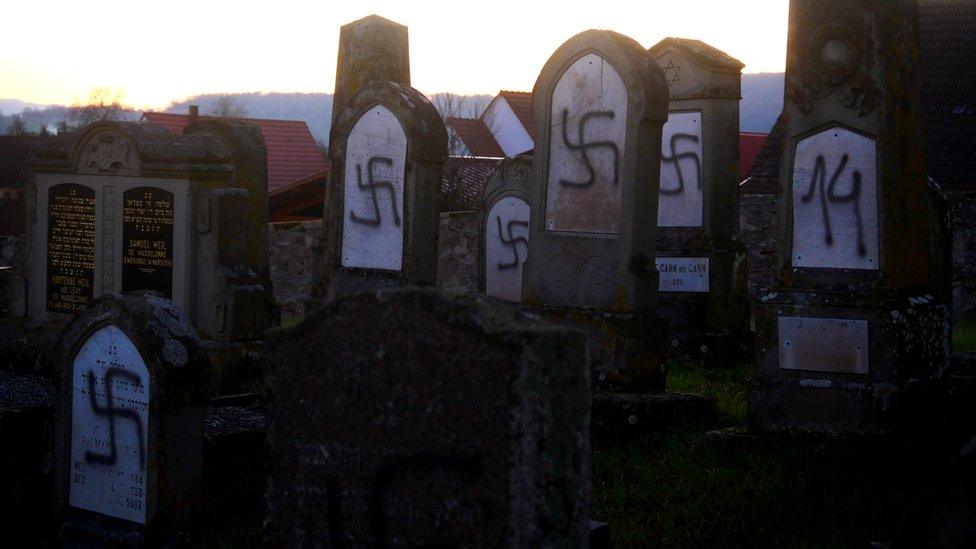 Graves daubed with anti-Semitic symbols and slogans in Westhoffen, France