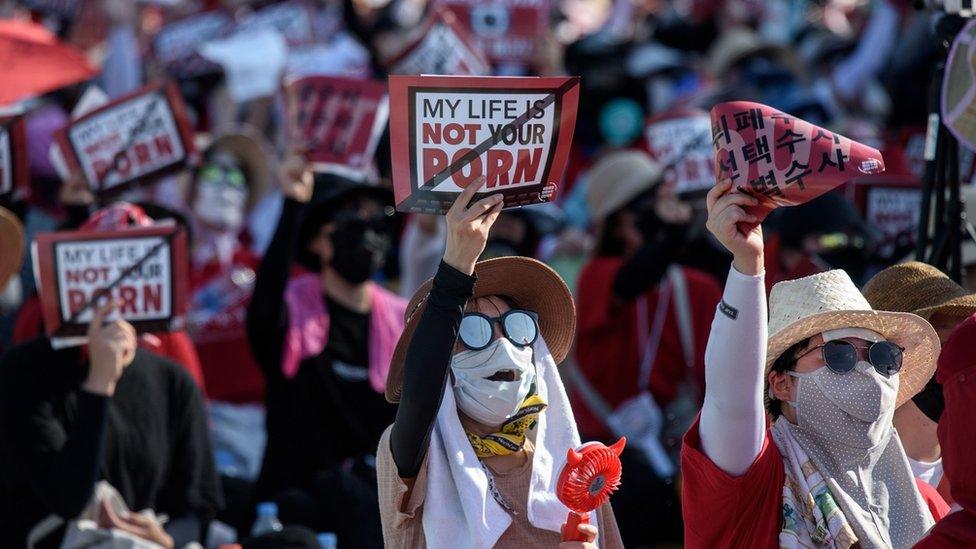 South Korean women hold up signs saying My Life Is Not Your Porn at a protest in Seoul