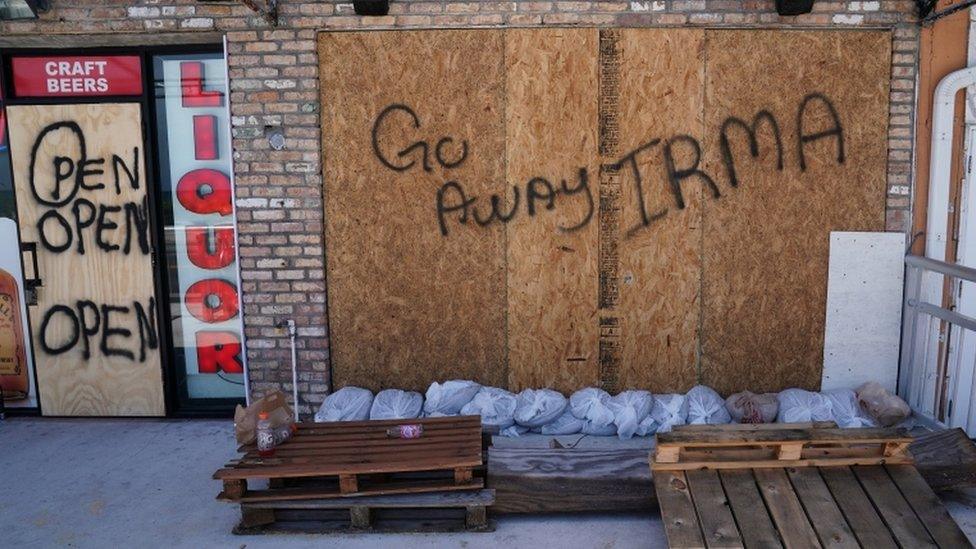 Go away Irma sign outside of a business