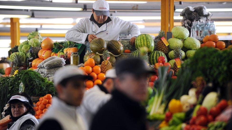 A vendor prepares vegetables in Moscow's Dorogomilovsky Market on February 16, 2011.