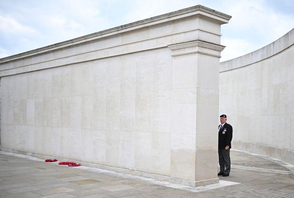 A veteran pays respects at the memorial to the British Service Personnel killed since World War II at the National Memorial Arboretum in Stafford, central England on June 6, 2024. 