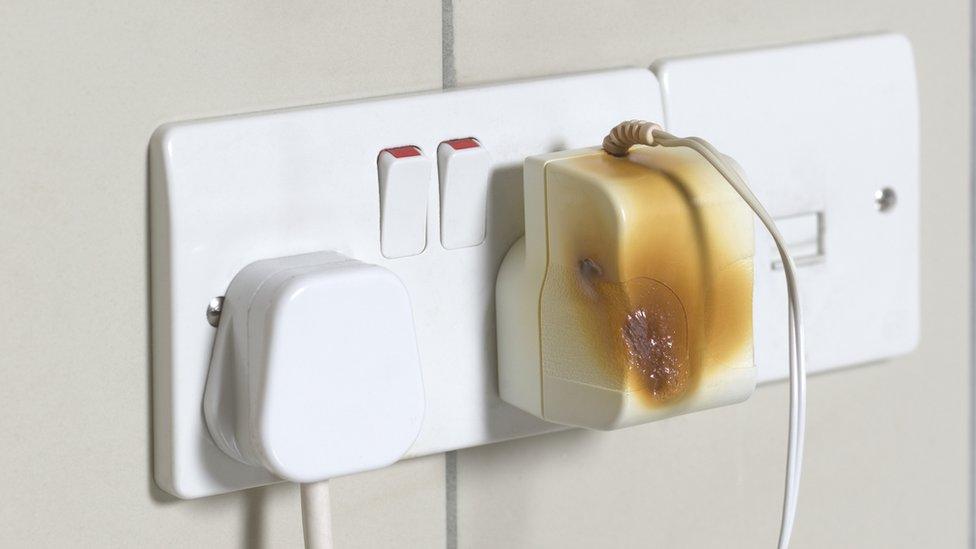 Damaged electrical plug socket