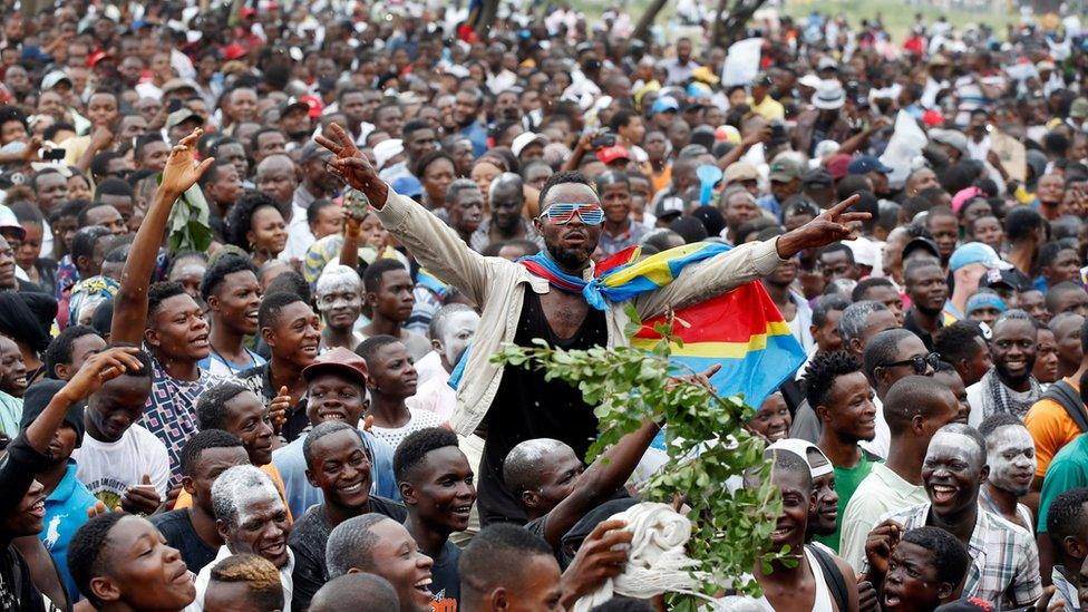 Supporters of Felix Tshisekedi, leader of the Congolese main opposition party, the Union for Democracy and Social Progress (UDPS) who was announced as the winner of the presidential elections, celebrate outside the party's headquarters in Kinshasa